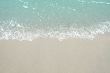 Fototapeta na wymiar Sea water wave and gold sand on the beach