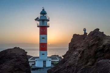 Raamstickers Tourist at Teno Lighthouse © AlexanderNikiforov