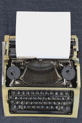 The writer's hands on a typewriter begin to write