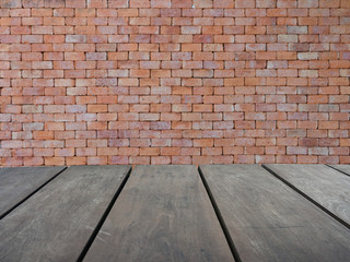 Empty top wooden shelves and red brick wall background