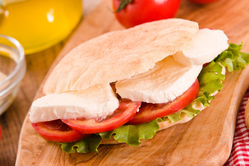 Puccia bread with mozzarella and tomato.