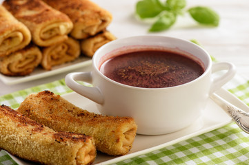 Croquettes polish style pancakes stuffed with beef and beetroot soup.