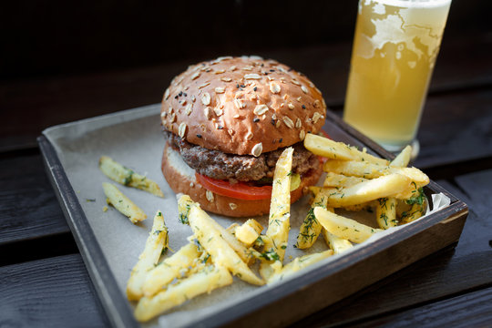 Fast food set: Hamburger, beer and fries. Close-up
