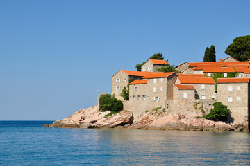Fototapeta na wymiar A view of the Sveti Stefan island on a summer day, Montenegro