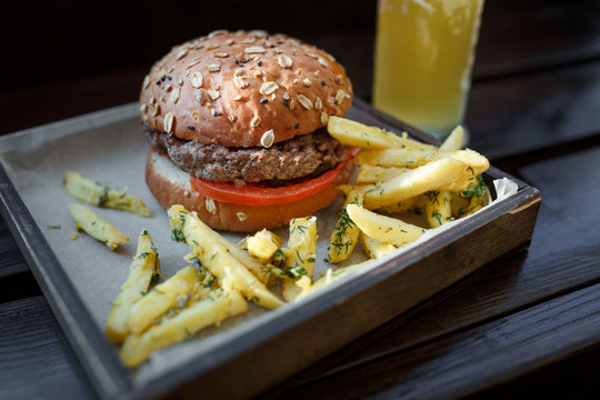 Fast food set: Hamburger, beer and fries. Close-up
