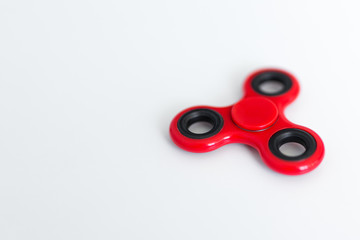 popular toy fidget spinner and copy space over white table