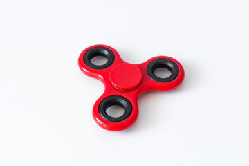 close up of popular toy fidget spinner over white