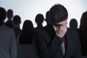 Man covering his face