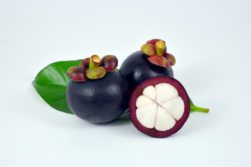 Mangosteens on white background.