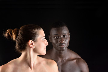 Fototapeta na wymiar Portrait of a couple on black background