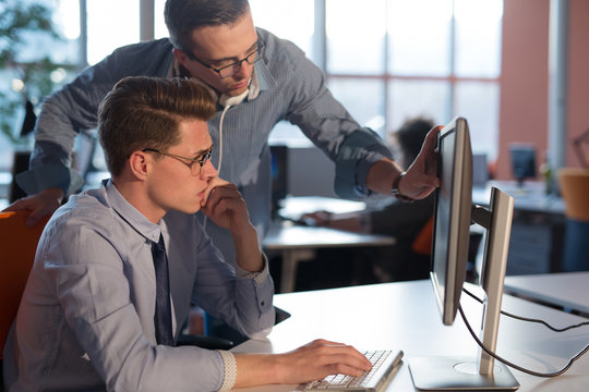 Two Business People Working With computer in office