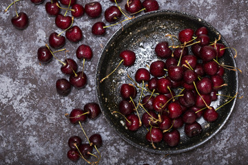 ripe cherry on a black plate