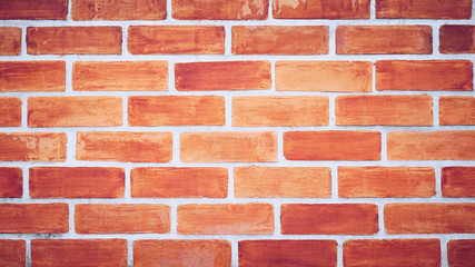 Empty red brick wall textured background.