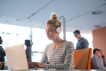 businesswoman using a laptop in startup office