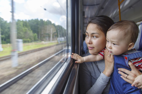 Mother and her son have a journey by train