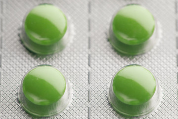 blister pack with green pills