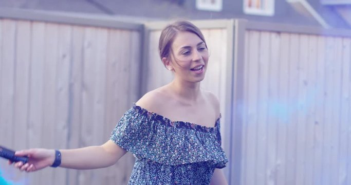 20s woman dances in blue smoke - slow motion