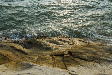 Rocky coast of the warm sea
