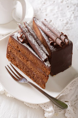 Exquisite French truffle cake with chocolate chips close up. vertical