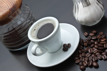 pile of coffee beans and a cup