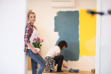 happy young couple doing home renovations