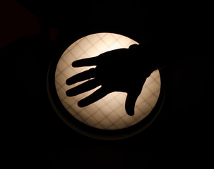 Light and silhouette hand