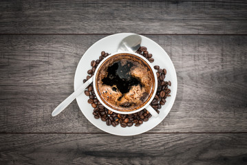 Coffee cup with coffee beans.