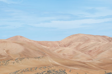 Fototapeta na wymiar Mountains of the desert under blue sky