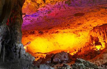 Cave on island at Halong Bay Vietnam.  Illuminated by light.