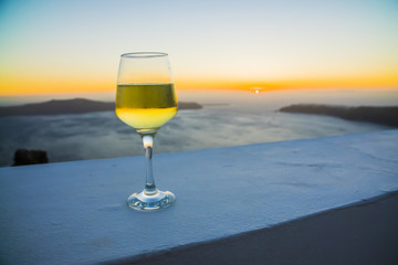 a glass of wine at sunset