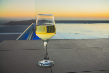 a glass of wine at sunset