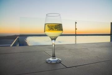 a glass of wine at sunset
