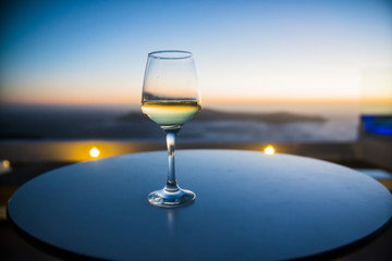 a glass of wine at sunset