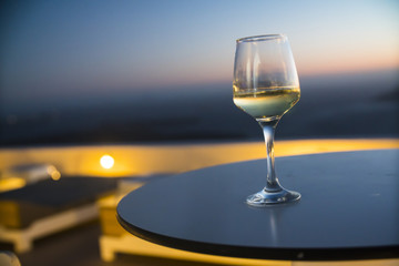 a glass of wine at sunset