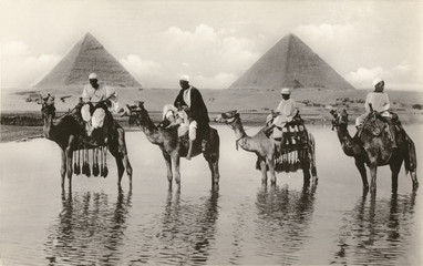 Camels and riders near the Pyramids  Egypt. Date: circa 1920s