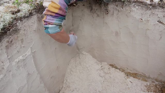 Stage of archaeological work - fine cleaning of the excavation wall
