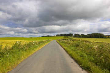 scenic road and storm cloud
