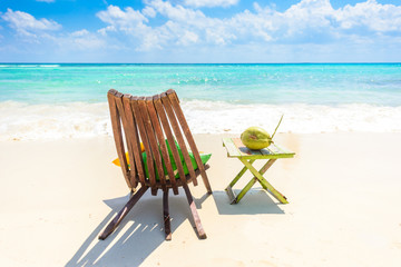 Playa del Carmen - relaxing on chair at paradise beach and city at caribbean coast of Quintana Roo, Mexico - obrazy, fototapety, plakaty