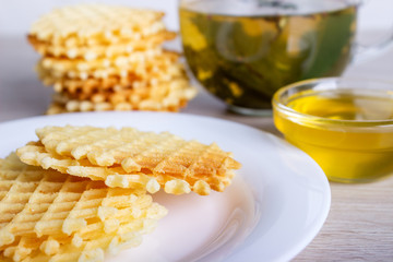 waffles with honey and cup of tea