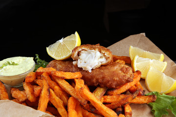 traditional British fish and chips on brown paper