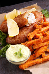 traditional British fish and chips on brown paper