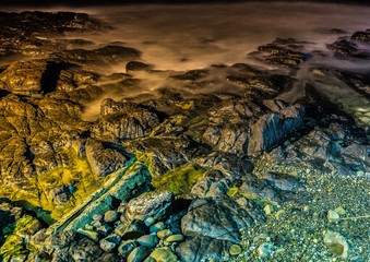 Nightshot of the waves and rocks at the indian ocean at the Wild Coast