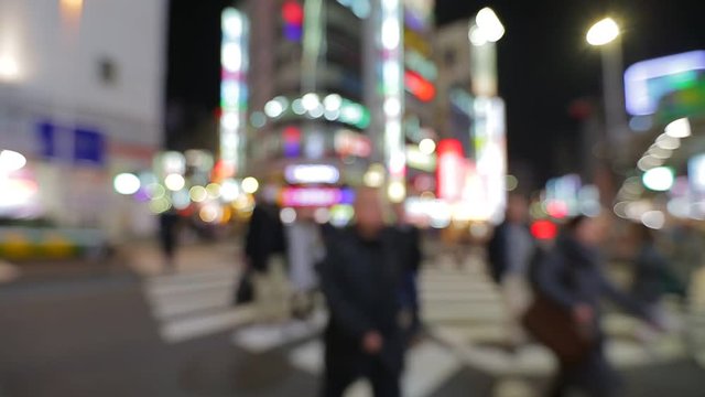  Out of focus background from busy big city with people crossing street in Tokyo of Japan