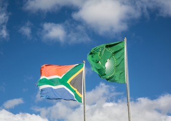 Waving flags of South Africa and the African Union