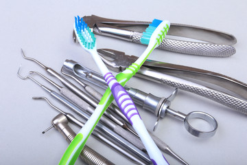 dental care toothbrush with dentist tools isolated on white background. Selective focus.