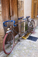 Fototapeta na wymiar Bicycle on the old street in the village, France