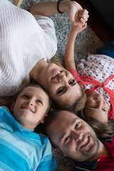 happy family lying on the floor