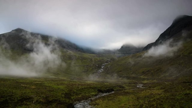 Morning mist rising above Cuillin Hills, Isle of Skye, Scotland. 4K Timelapse 