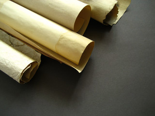 Old paper scroll on grey background