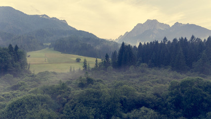Obraz premium Aerial view of sunrise over a valley.